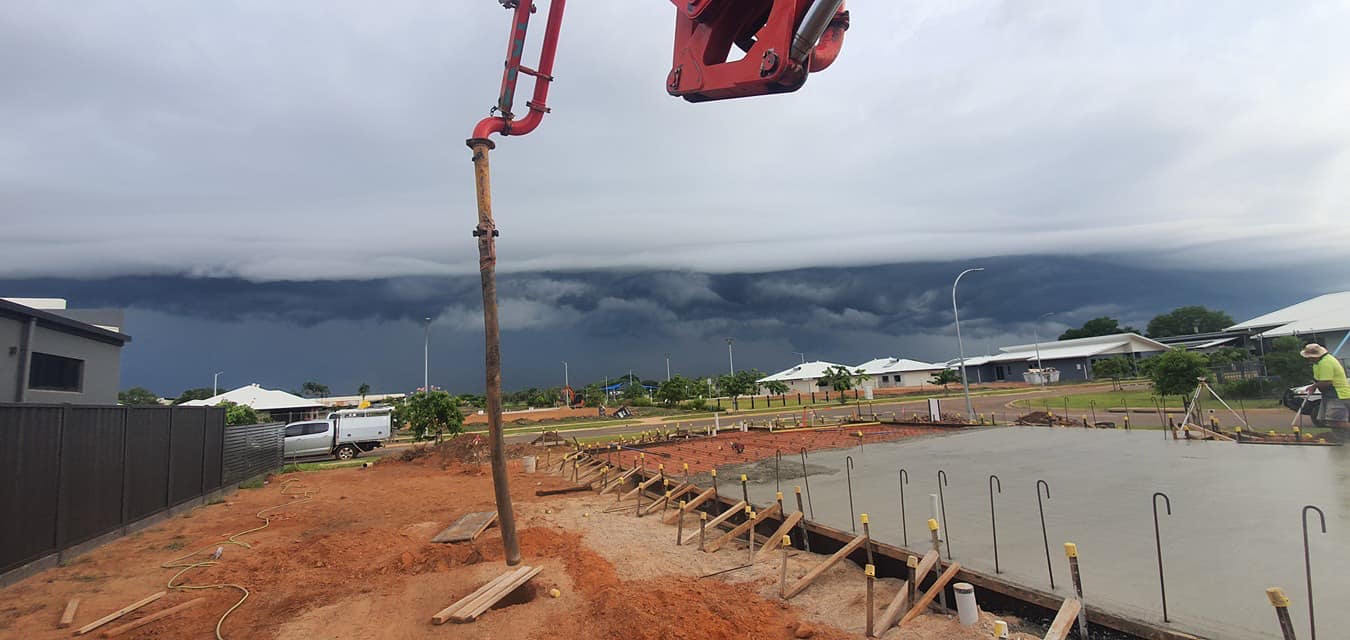 Concrete pour in Darwin with dramatic storm clouds